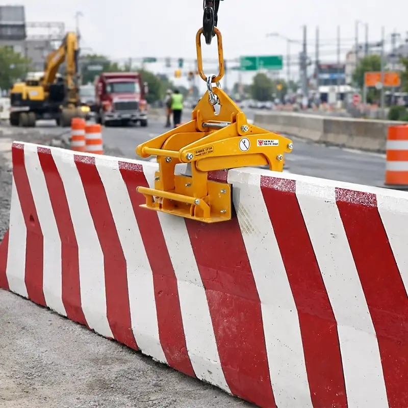 Aardwolf ABL255-2000 Concrete Barrier Lifter lifting a Jersey barrier